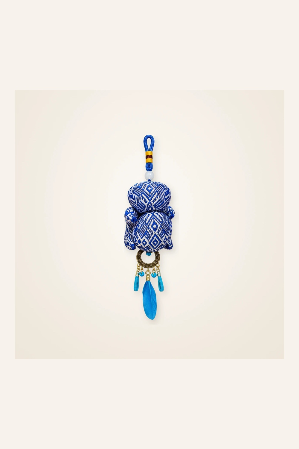 Front view of brocade bag charm Brocade Tassel · Blue Geometry in handwoven brocade