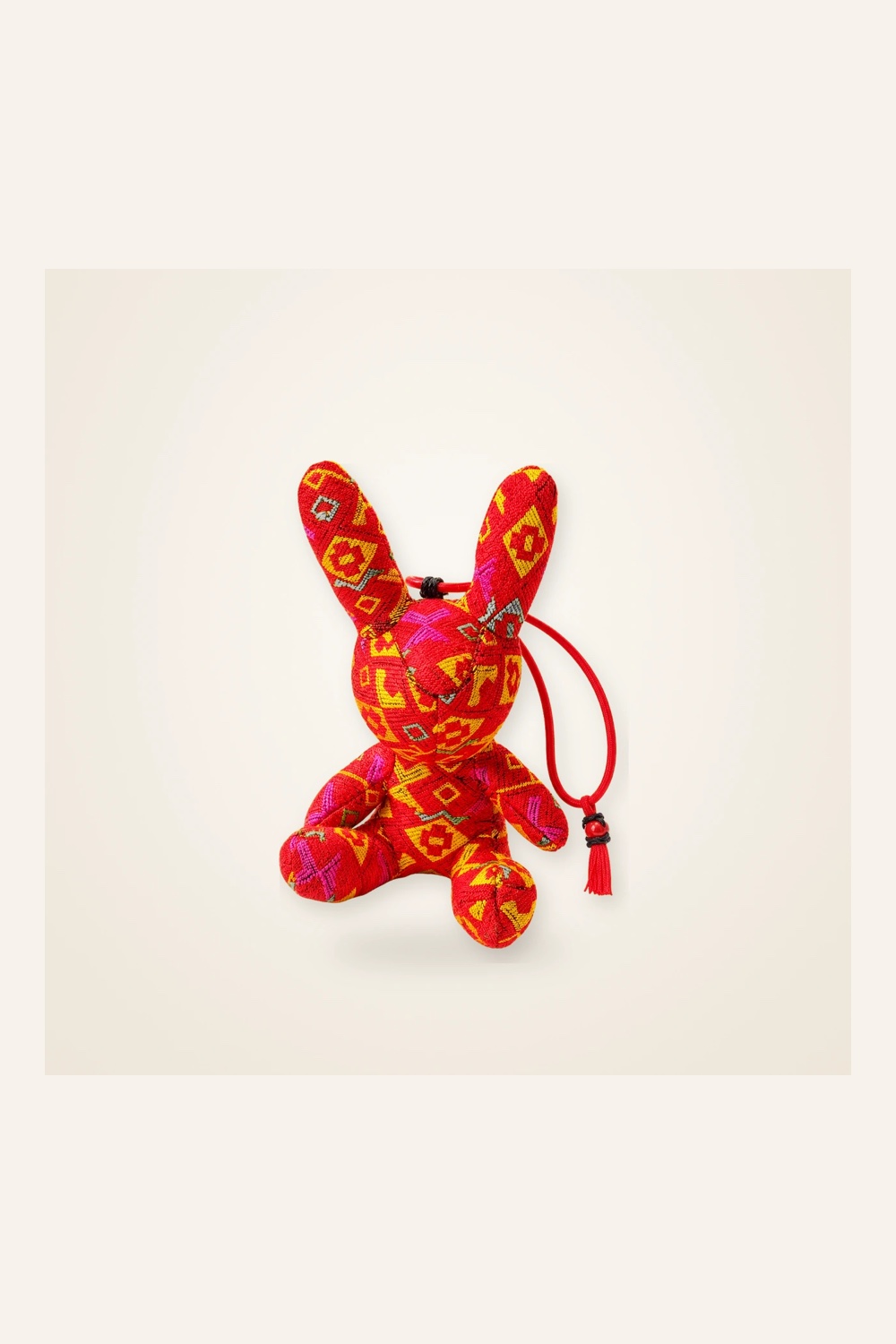 Front view of handmade textile figure Brocade Rabbit · Cinnabar in handwoven brocade