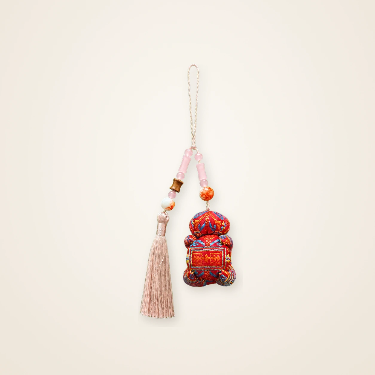 Front view of brocade bag charm Long Tassel · Eternal Bloom, handwoven brocade woven in the longevity-blossom motif