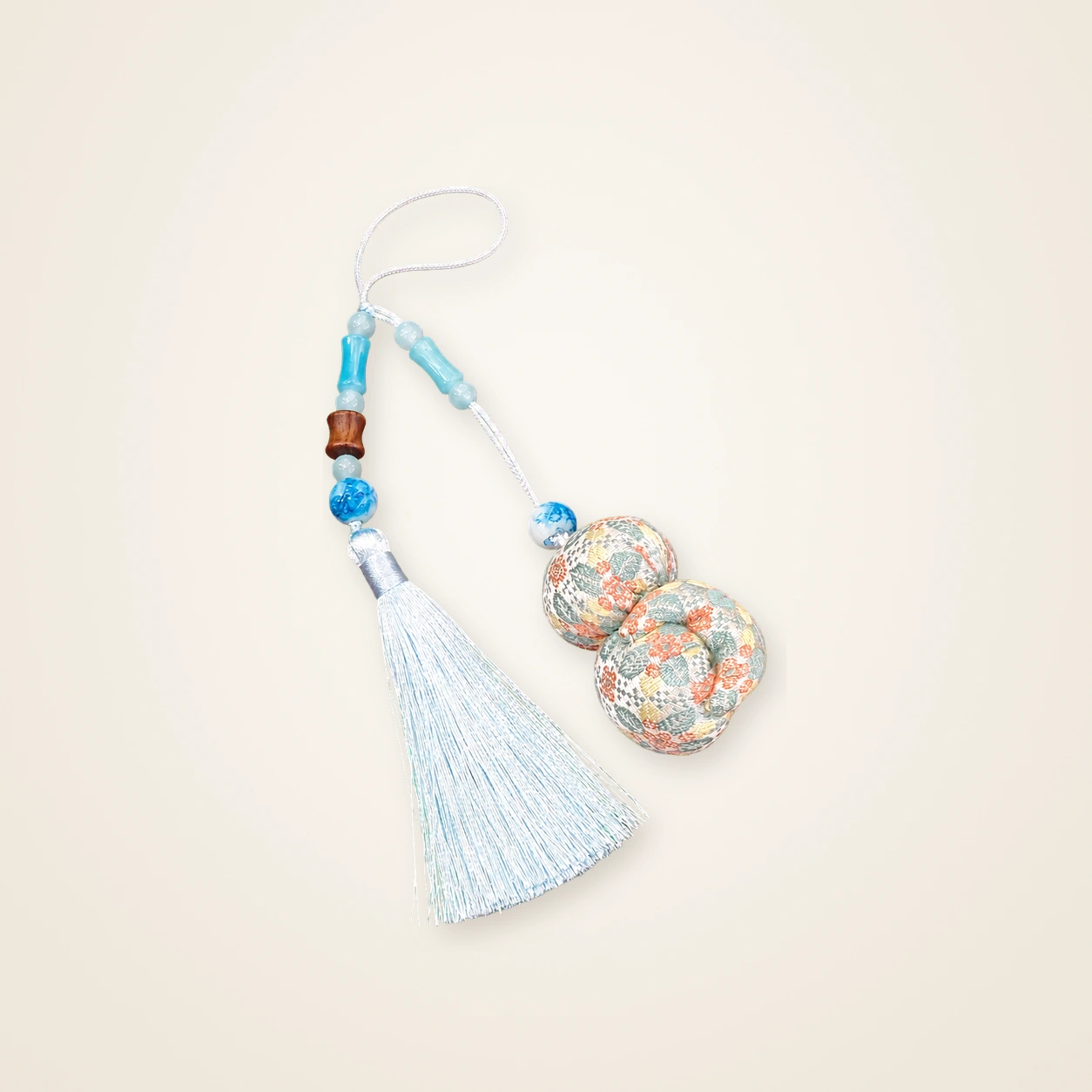 Front view of brocade bag charm Long Tassel · Osmanthus Blossom, handwoven brocade woven in the osmanthus-blossom motif