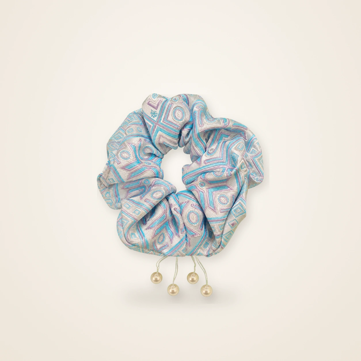 Front view of brocade scrunchie Brocade Halo · Azure Garden of Blessings, handwoven brocade woven in the field-of-blessings motif