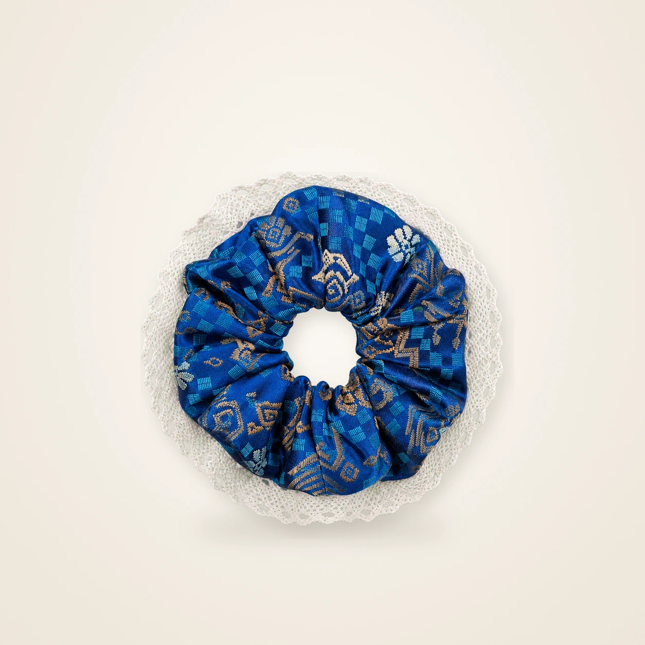 Front view of brocade scrunchie Brocade Halo · Gold & Azure Lone Phoenix, handwoven brocade woven in the phoenix and phoenix-blossom motif