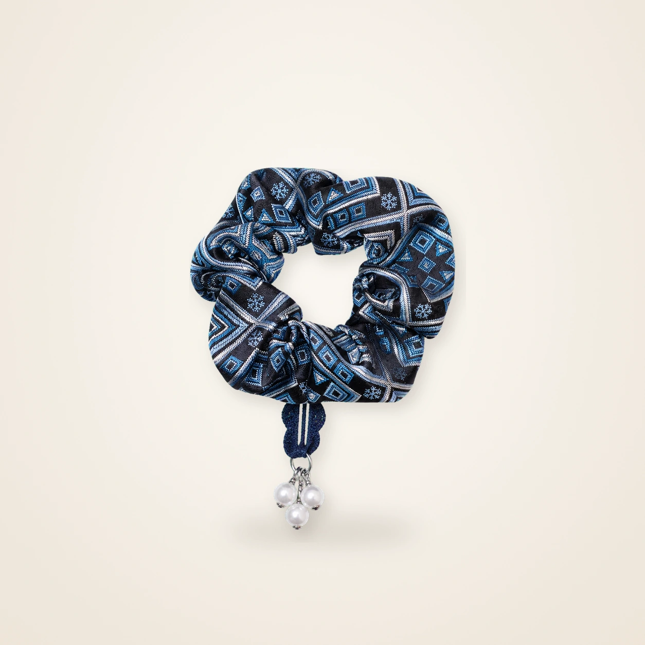 Front view of brocade scrunchie Brocade Halo · Midnight Garden, handwoven brocade woven in the field-of-blessings motif
