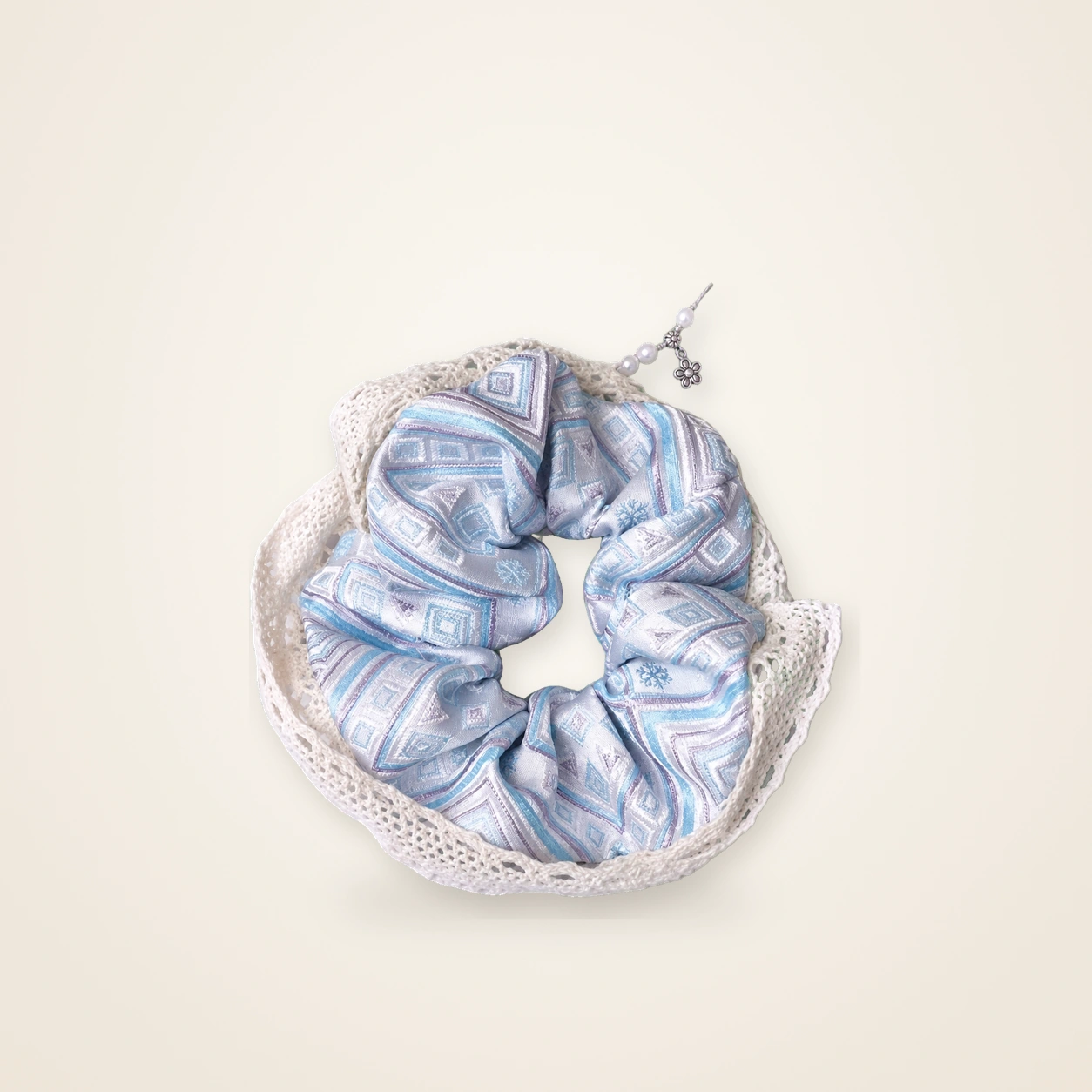 Front view of brocade scrunchie Brocade Halo · Pale Blue Field of Blessings with Lace, handwoven brocade woven in the field-of-blessings motif