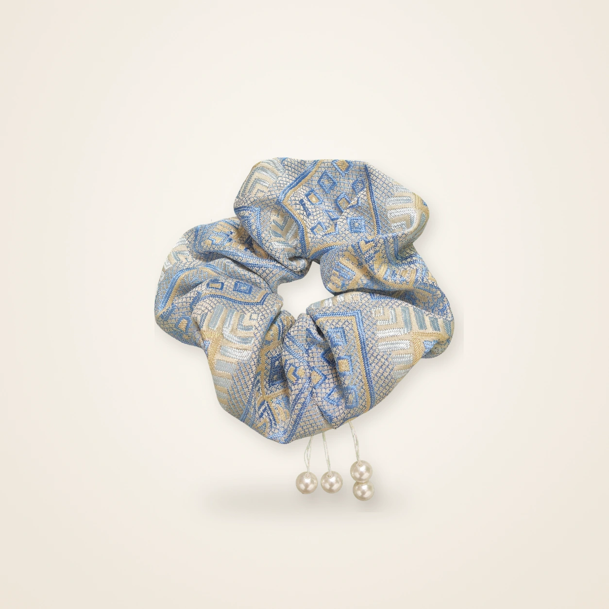 Front view of brocade scrunchie Brocade Halo · Phoenix Blossom, handwoven brocade woven in the phoenix and phoenix-blossom motif
