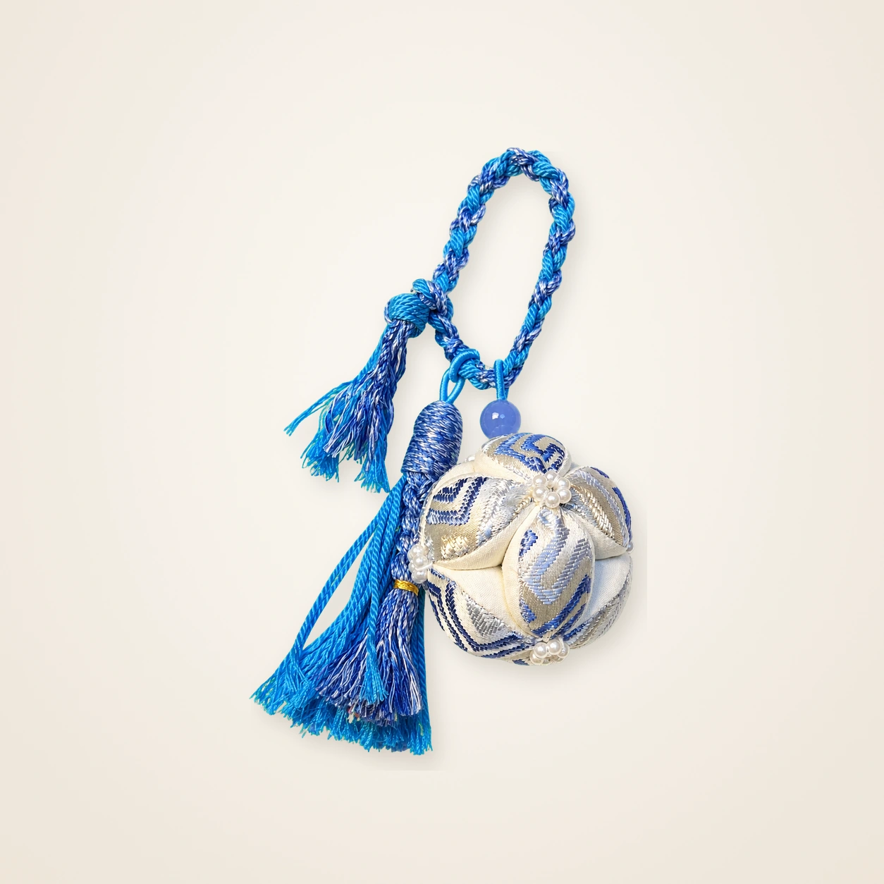 Front view of brocade bag charm Brocade Orb · Royal Blue, handwoven brocade made as a brocade orb (xiuqiu)