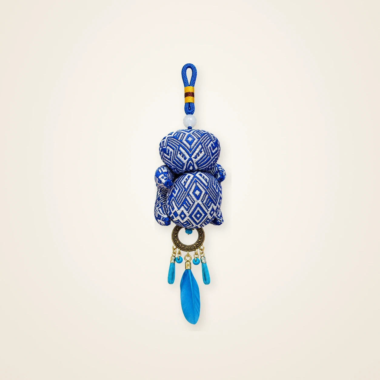 Front view of brocade bag charm Brocade Tassel · Blue Geometry, handwoven brocade woven in the highland geometric motif
