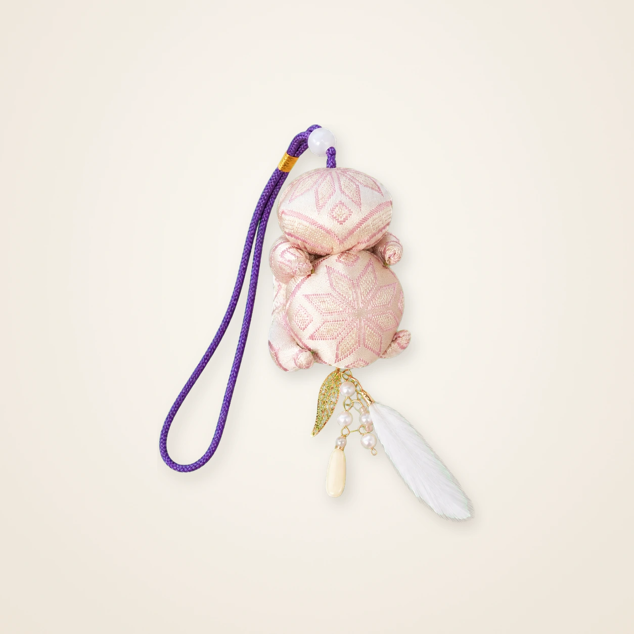 Front view of brocade bag charm Brocade Tassel · Blush Butterfly & Blossom, handwoven brocade woven in the butterfly-and-blossom motif