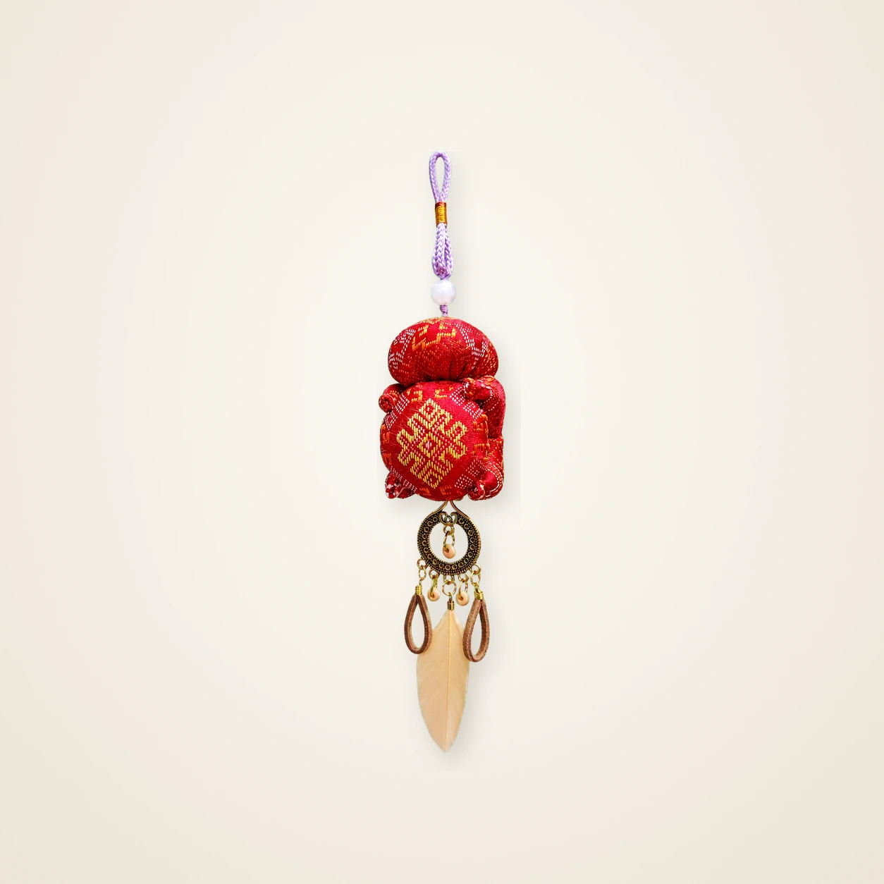 Front view of brocade bag charm Brocade Tassel · Cinnabar Prosperity, handwoven brocade made as a brocade tassel charm