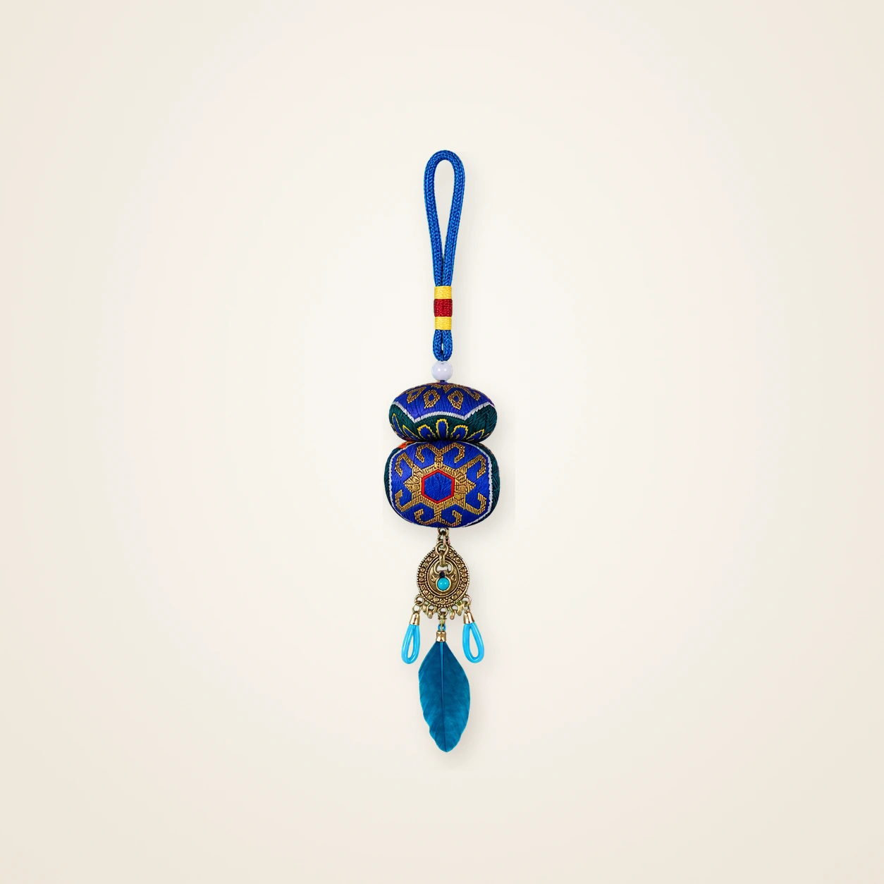 Front view of brocade bag charm Guardian Blessing · Azure & Gold with a Cinnabar Heart, handwoven brocade made as a momie guardian sachet