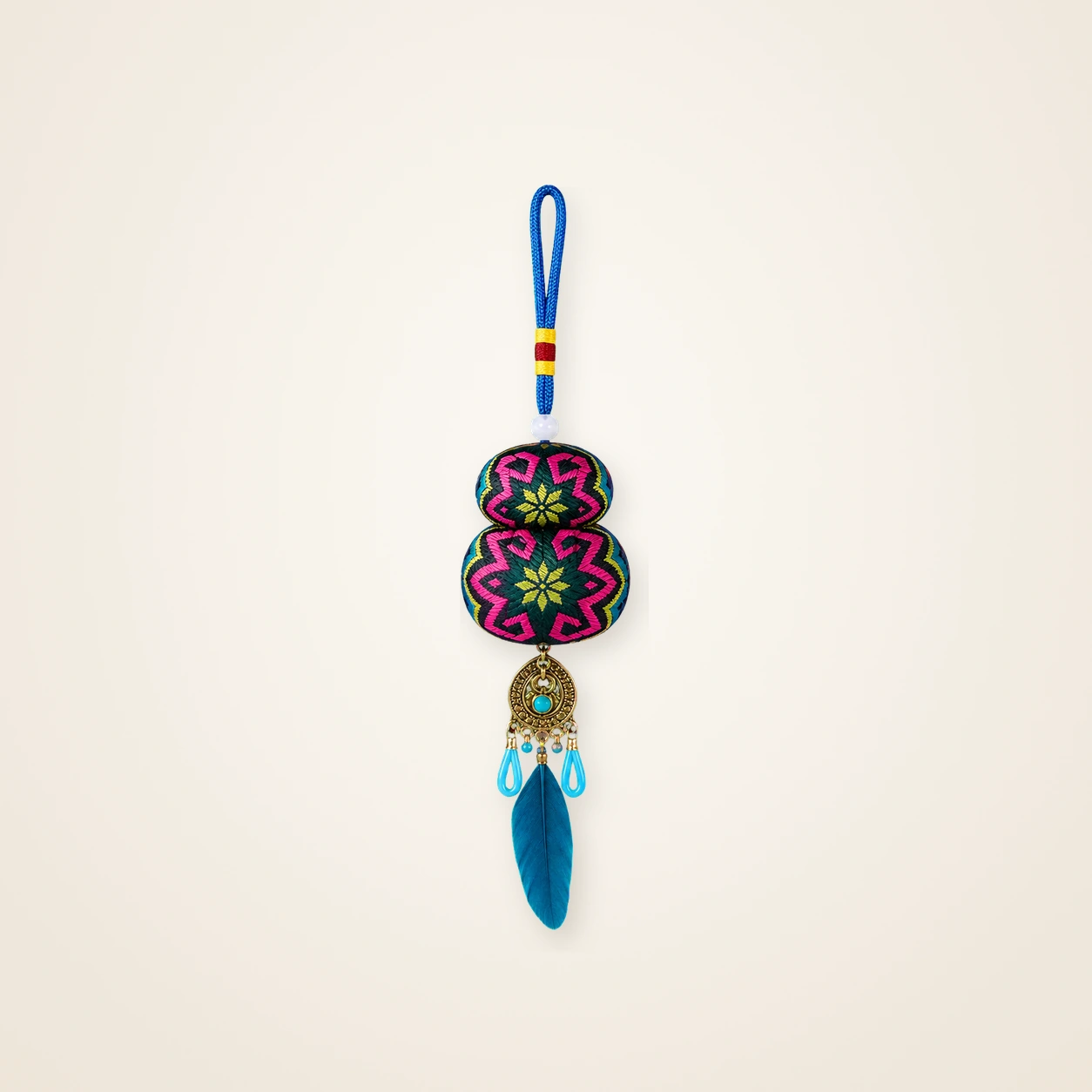 Front view of brocade bag charm Guardian Blessing · Jade & Blush Geometry, handwoven brocade woven in the highland geometric motif