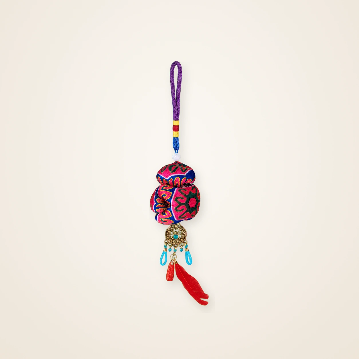 Front view of brocade bag charm Guardian Blessing · Jade & Cinnabar Motif, handwoven brocade made as a momie guardian sachet