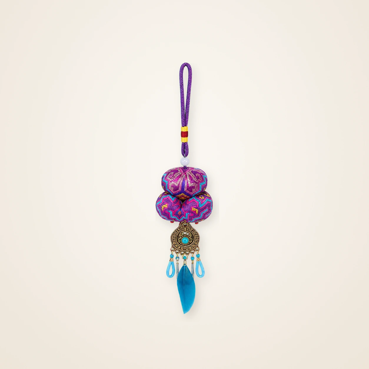 Front view of brocade bag charm Guardian Blessing · Violet & Blush Geometry, handwoven brocade woven in the highland geometric motif