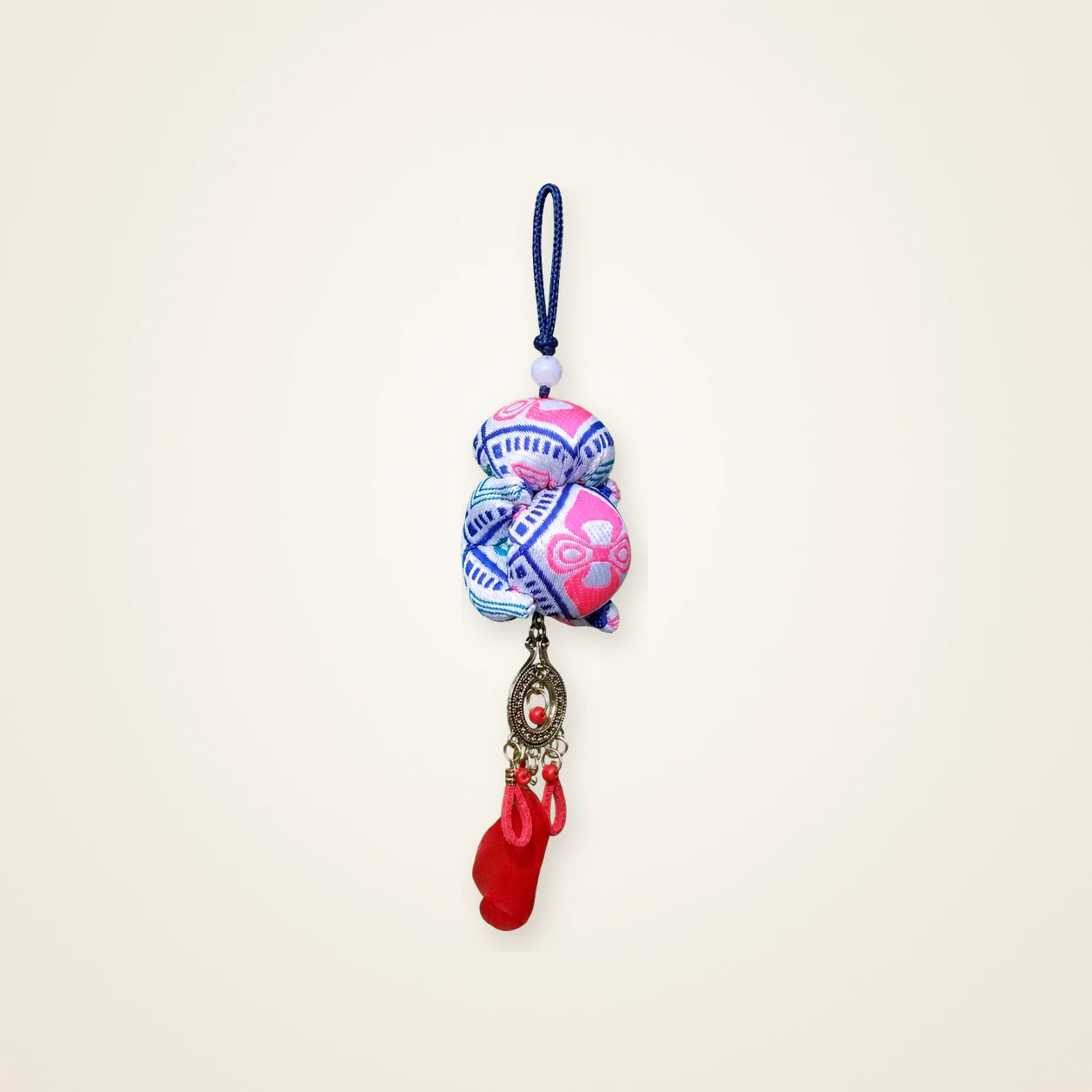 Front view of brocade bag charm Guardian Blessing · Rose Tujia Brocade Motif, handwoven brocade woven in the xilankapu coverlet motif