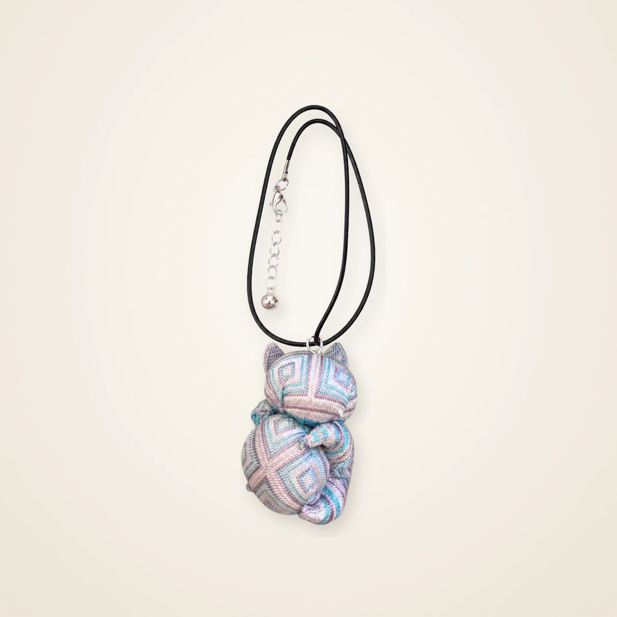 Front view of handmade brocade necklace Guardian Blessing · Soft Blush, handwoven brocade made as a momie guardian sachet