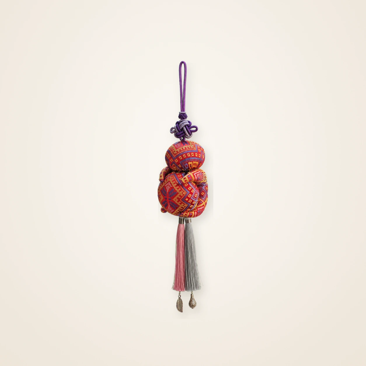 Front view of brocade bag charm Seven-Centimetre Sachet · Crimson Butterfly, handwoven brocade woven in the butterfly-and-blossom motif