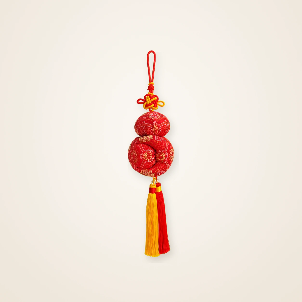 Front view of brocade bag charm Seven-Centimetre Sachet · Crimson Golden Abundance, handwoven brocade made as a brocade tassel charm