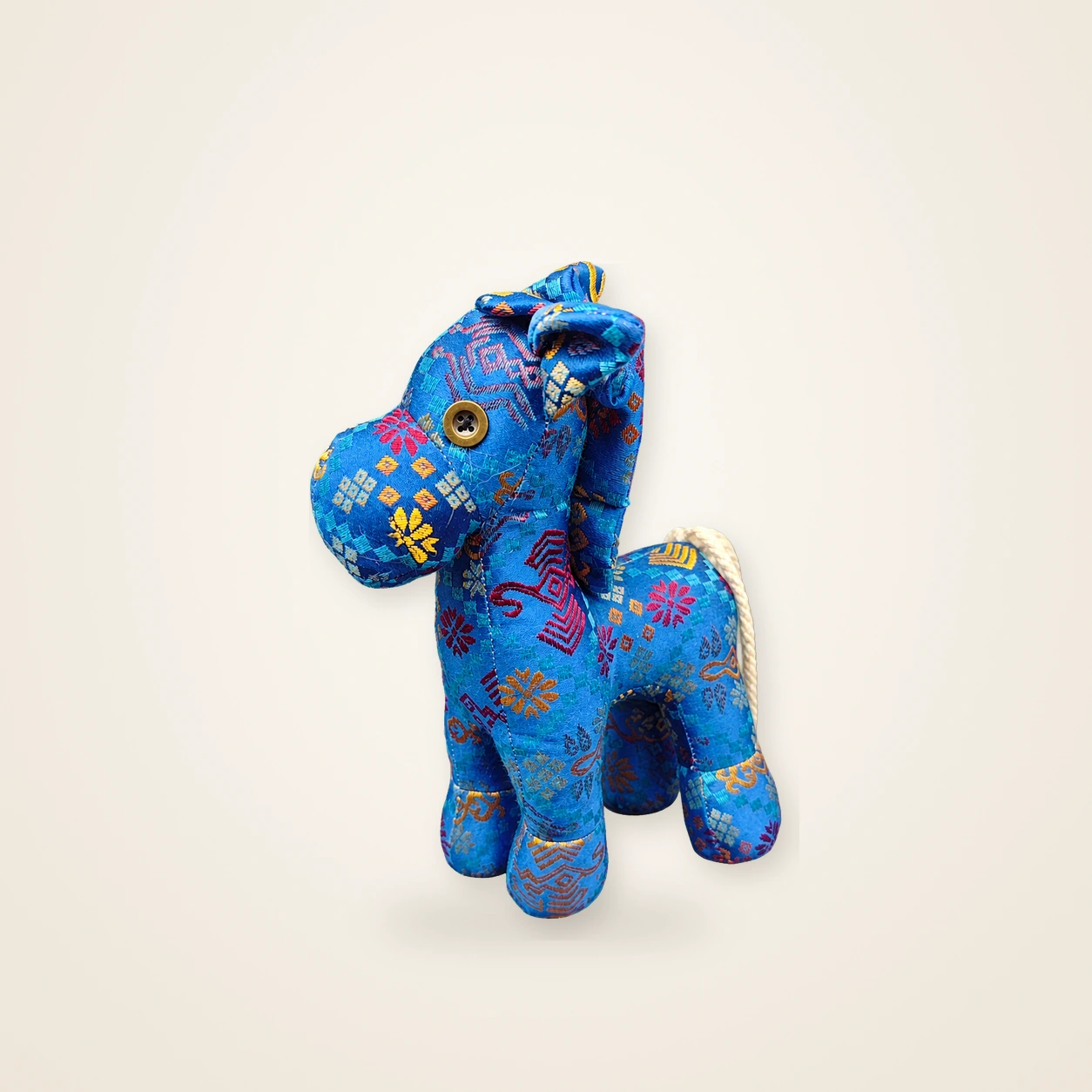 Front view of handmade textile figure Auspicious Horse · Indigo, handwoven brocade made as a standing auspicious horse