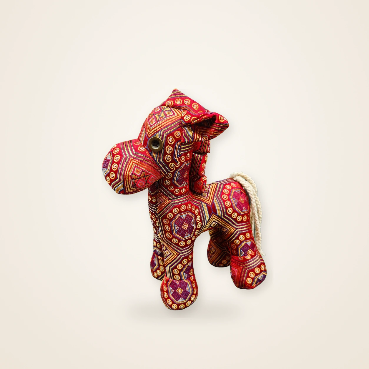 Front view of handmade textile figure Auspicious Horse · Vermilion, handwoven brocade made as a standing auspicious horse