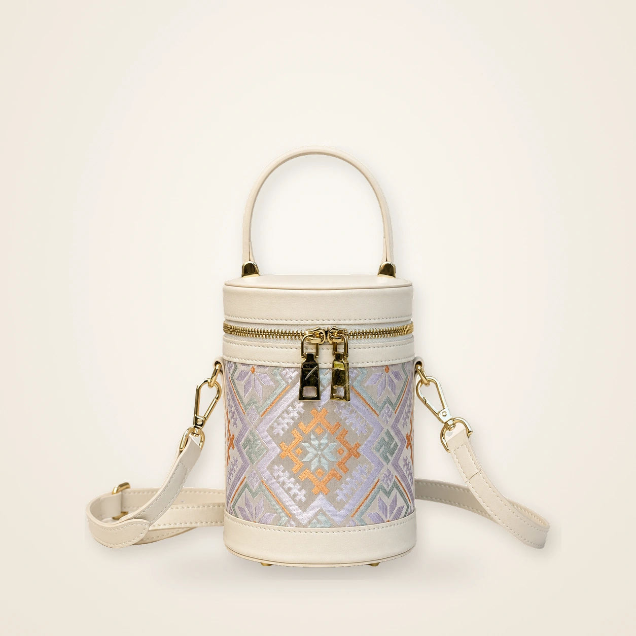 Front view of woven bucket bag Brocade Vessel · Cloud White, handwoven brocade woven in the cloud-and-mist motif