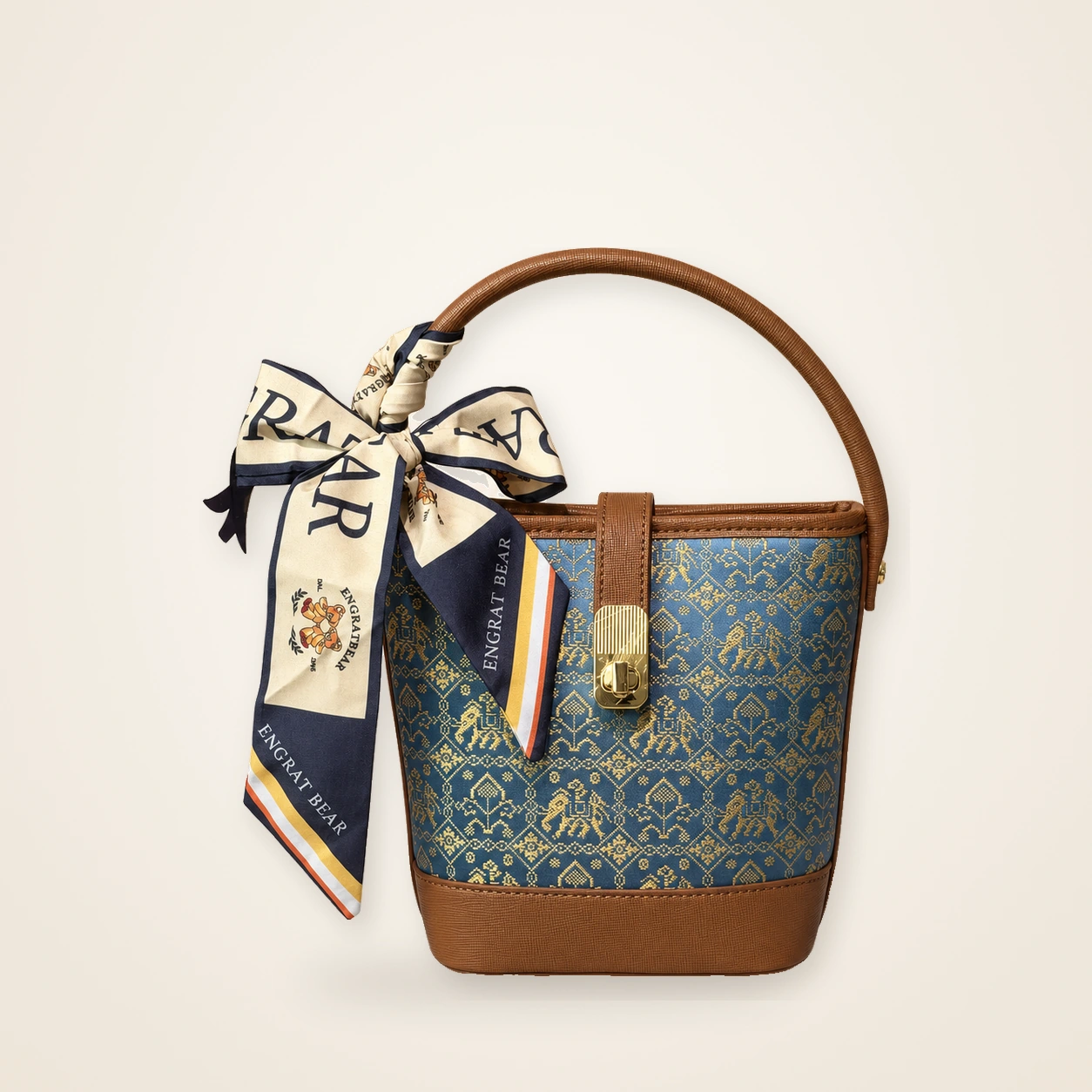 Front view of woven bucket bag Myriad Forms · Golden Brown, handwoven brocade woven in the wanxiang myriad-forms motif