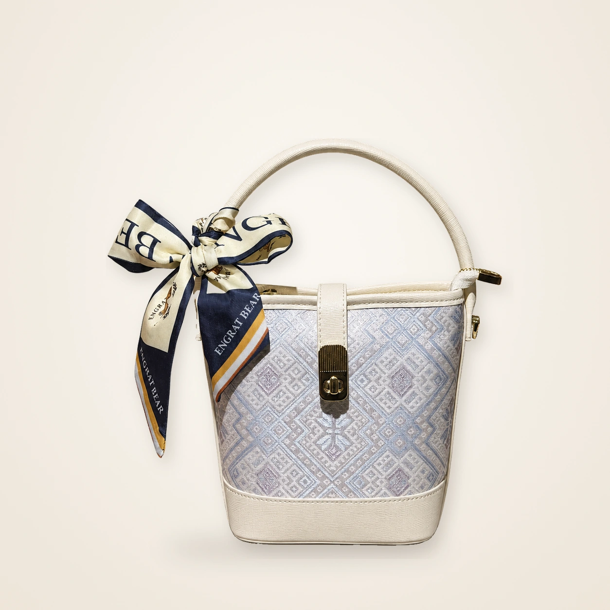 Front view of woven bucket bag Butterfly Reverie · Pearl Glow, handwoven brocade woven in the butterfly-and-blossom motif