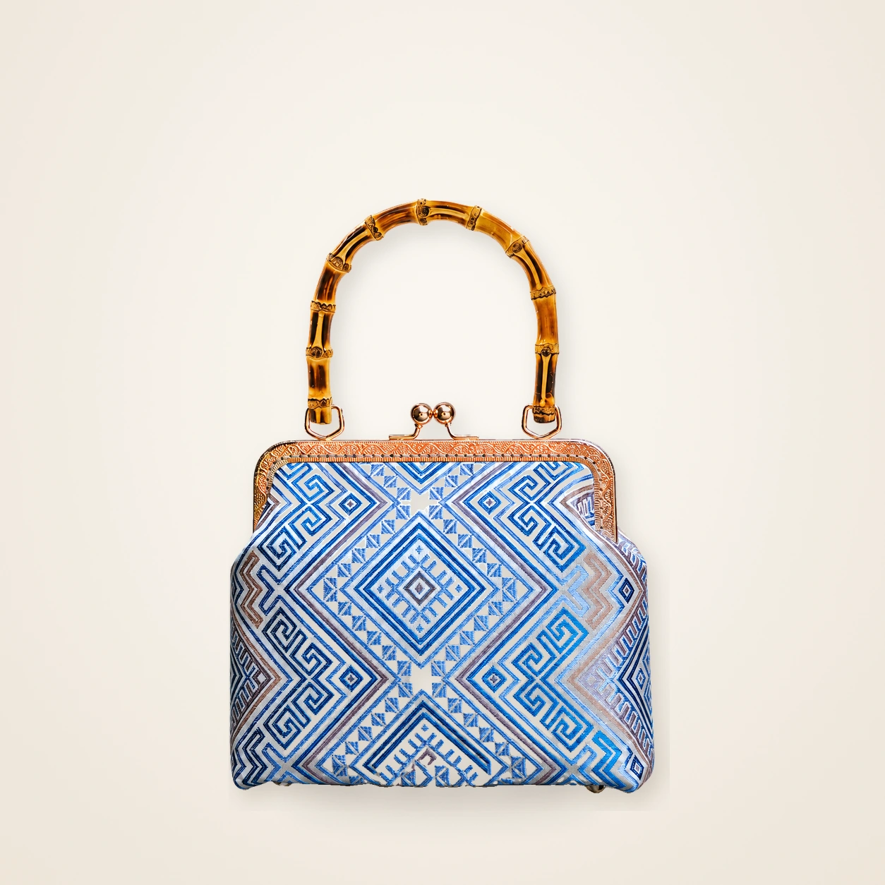 Front view of woven mini frame bag Mountain Echo · Silver Blue, handwoven brocade woven in the huiwen meander motif