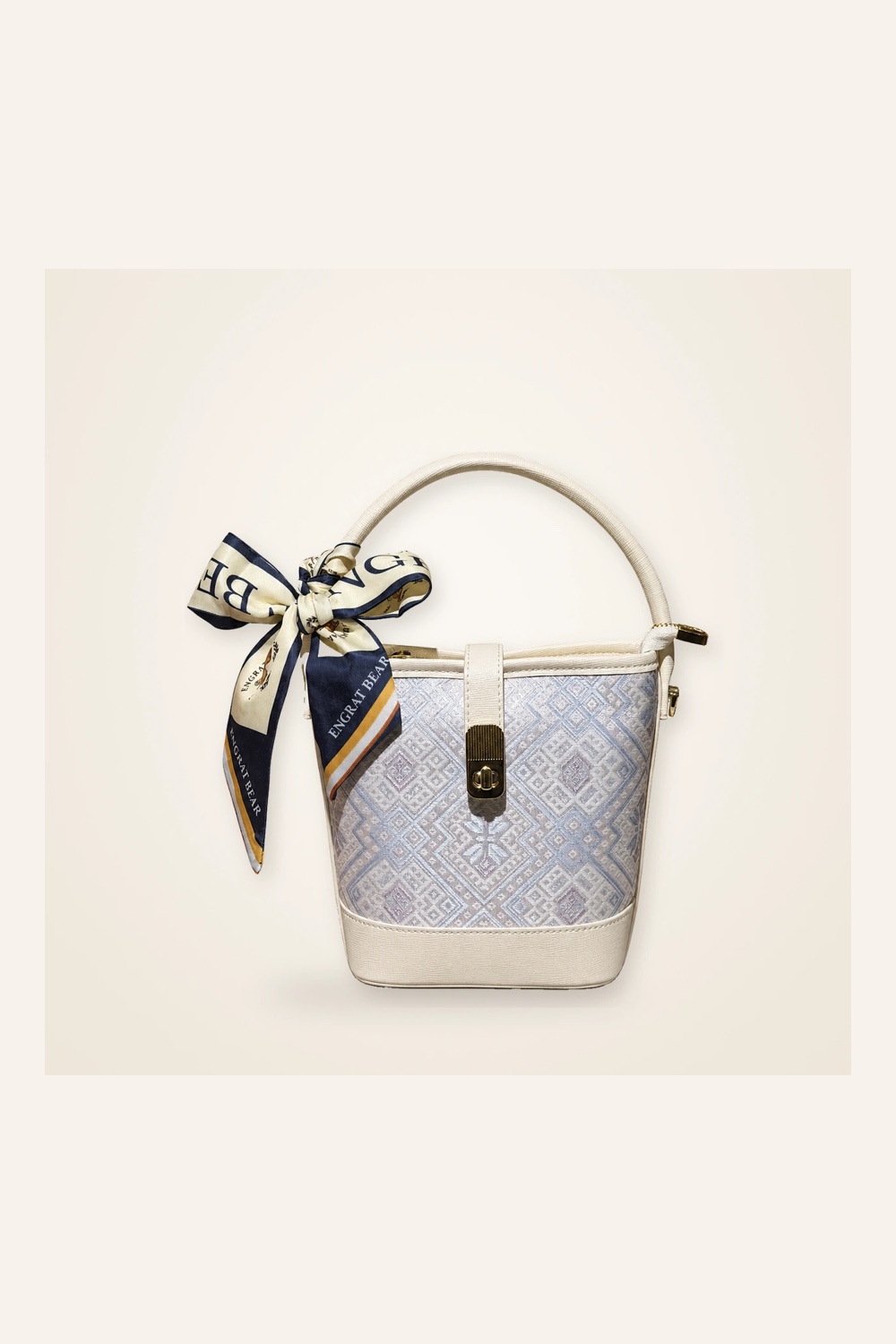 Front view of woven bucket bag Butterfly Reverie · Pearl Glow, handwoven brocade woven in the butterfly-and-blossom motif