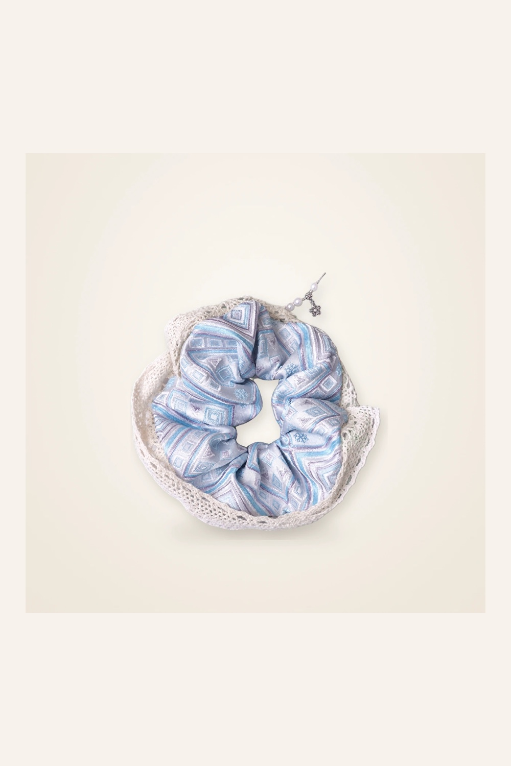 Front view of brocade scrunchie Brocade Halo · Pale Blue Field of Blessings with Lace, handwoven brocade woven in the field-of-blessings motif