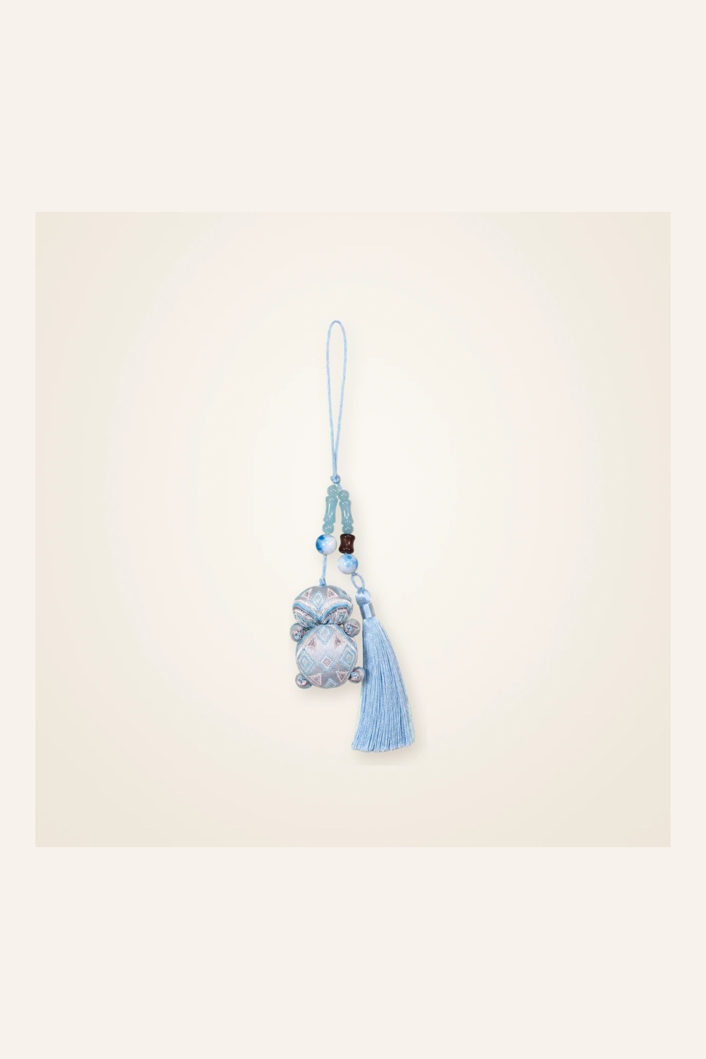 Front view of brocade bag charm Brocade Tassel · Mist Blue, handwoven brocade made as a brocade tassel charm