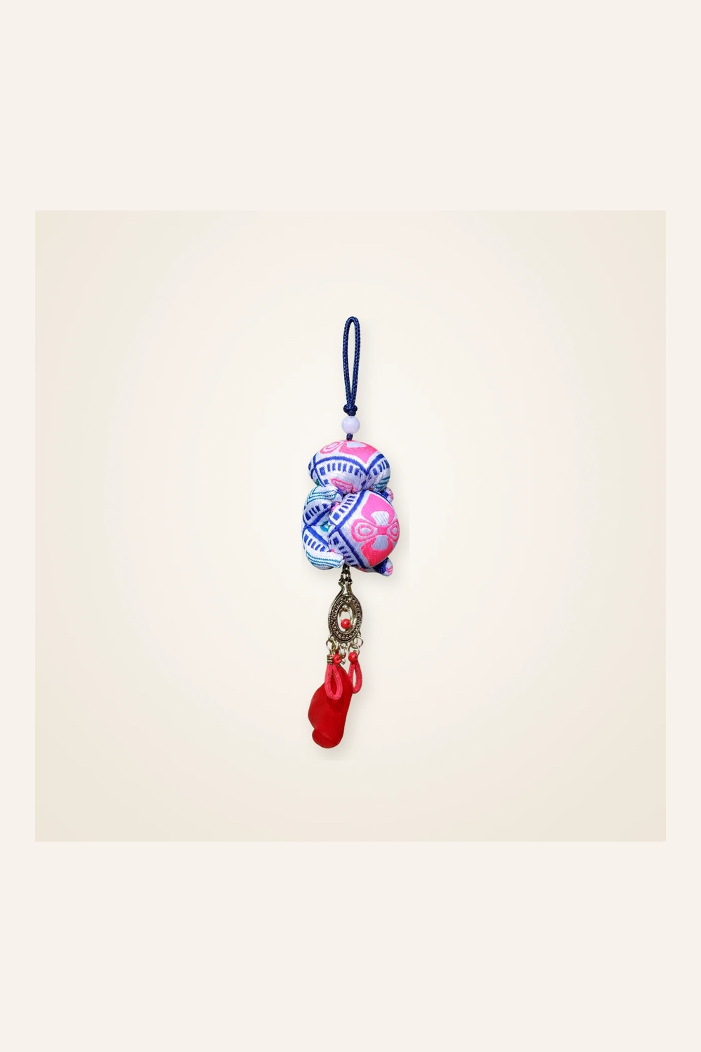 Front view of brocade bag charm Guardian Blessing · Rose Tujia Brocade Motif, handwoven brocade woven in the xilankapu coverlet motif