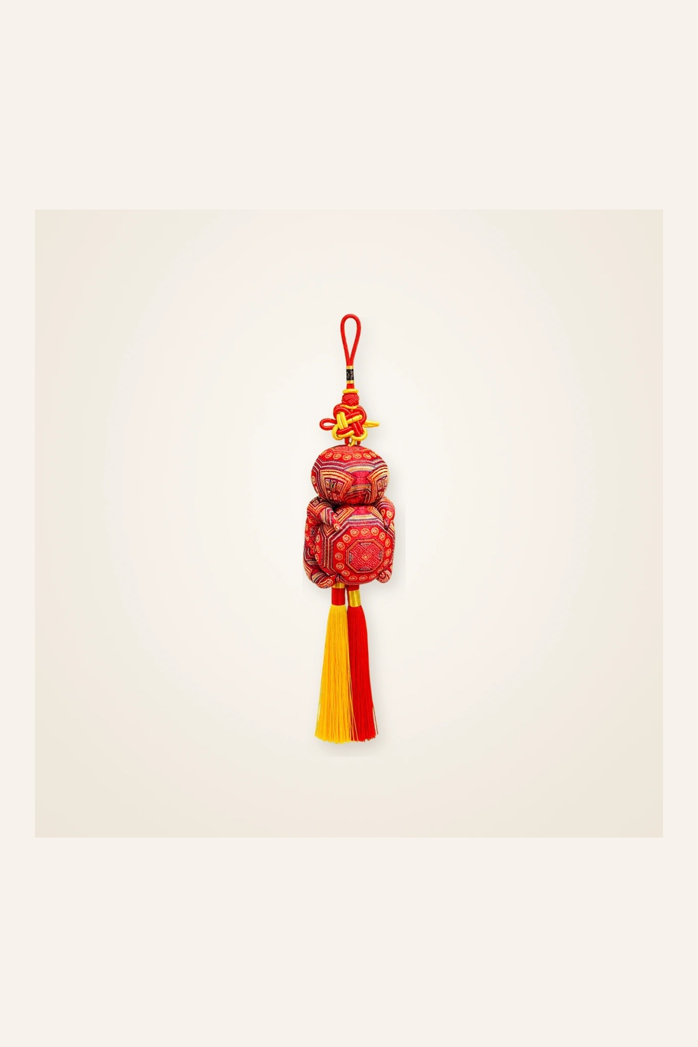 Front view of brocade bag charm Grand Guardian · Vermilion, handwoven brocade made as a momie guardian sachet