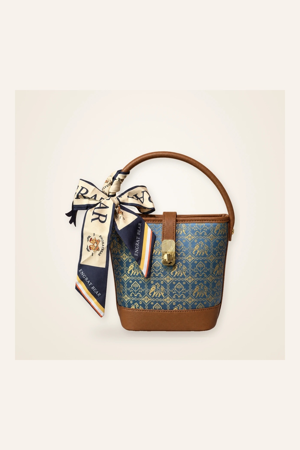 Front view of woven bucket bag Myriad Forms · Golden Brown, handwoven brocade woven in the wanxiang myriad-forms motif