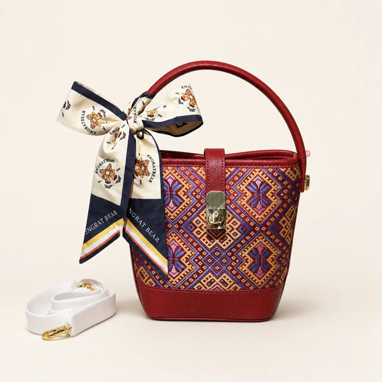 Front view of woven bucket bag Butterfly Reverie · Cinnabar, handwoven brocade woven in the butterfly-and-blossom motif