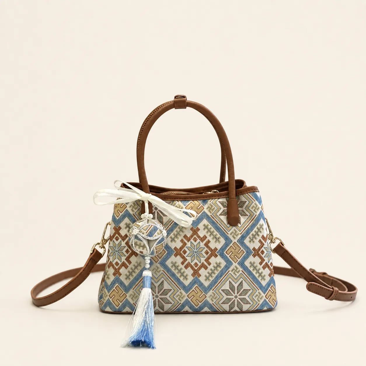 Front view of woven tote bag Mountains & Rivers · Far Journey, handwoven brocade woven in the highland geometric motif
